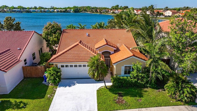 birds eye view of property featuring a water view