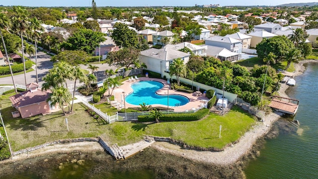 drone / aerial view with a water view and a residential view