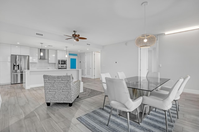 dining room with ceiling fan, recessed lighting, visible vents, and baseboards