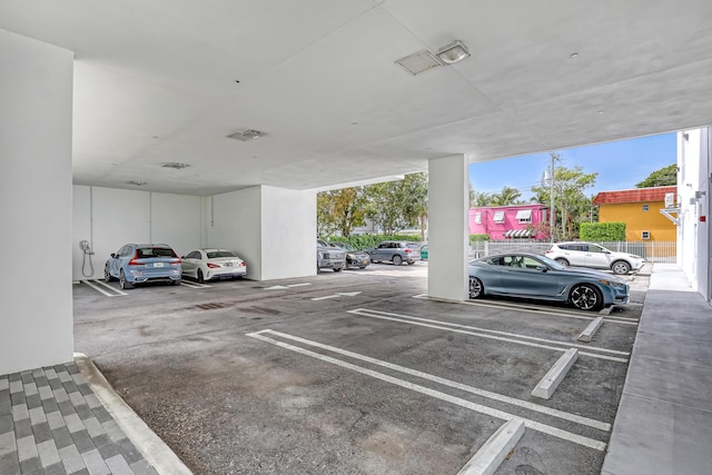 view of vehicle parking featuring a parking deck