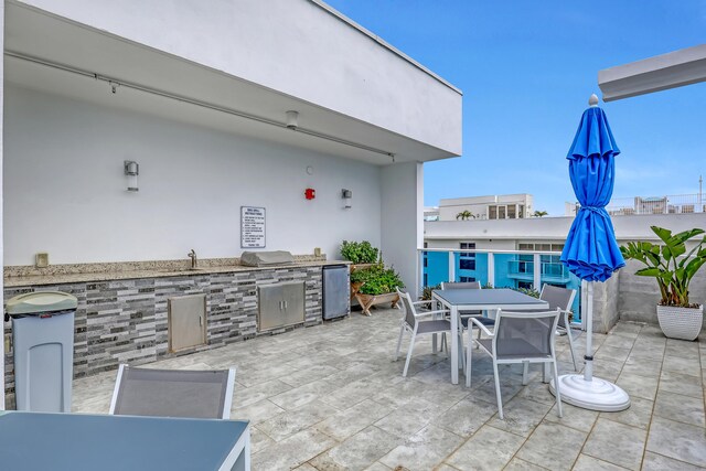 view of patio featuring grilling area, area for grilling, and outdoor dining space