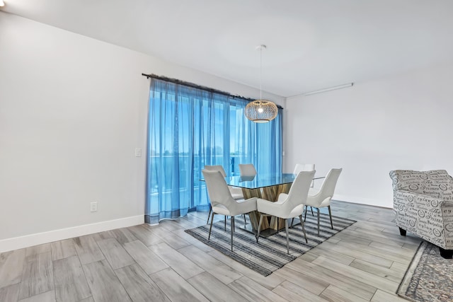 dining area with wood finish floors and baseboards