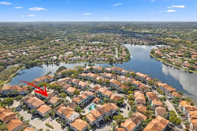 birds eye view of property with a residential view and a water view