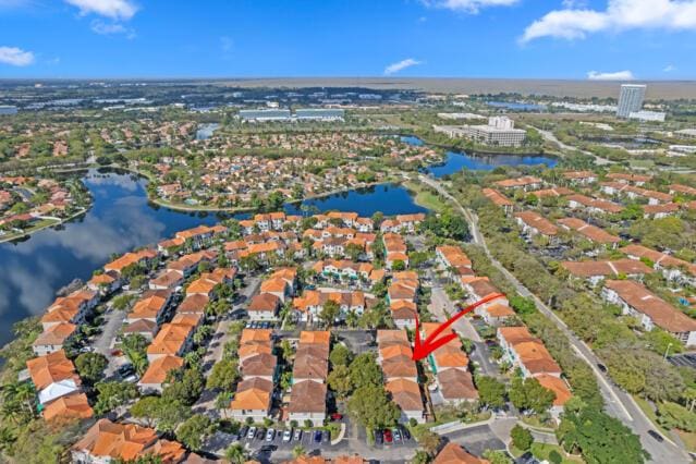 bird's eye view featuring a water view and a residential view