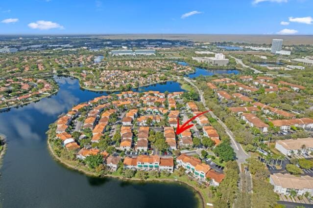 birds eye view of property featuring a water view