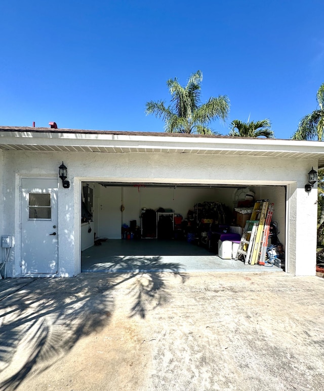 garage featuring driveway