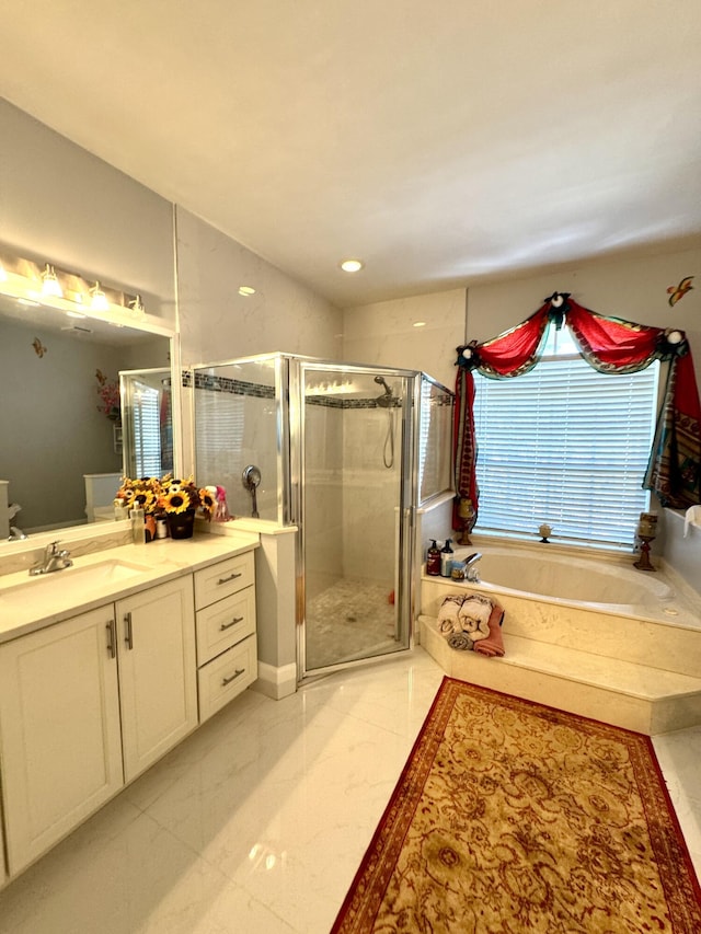 bathroom with toilet, a garden tub, vanity, and a shower stall