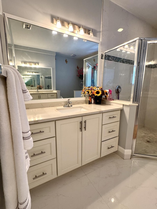 full bathroom with visible vents, marble finish floor, a stall shower, and vanity