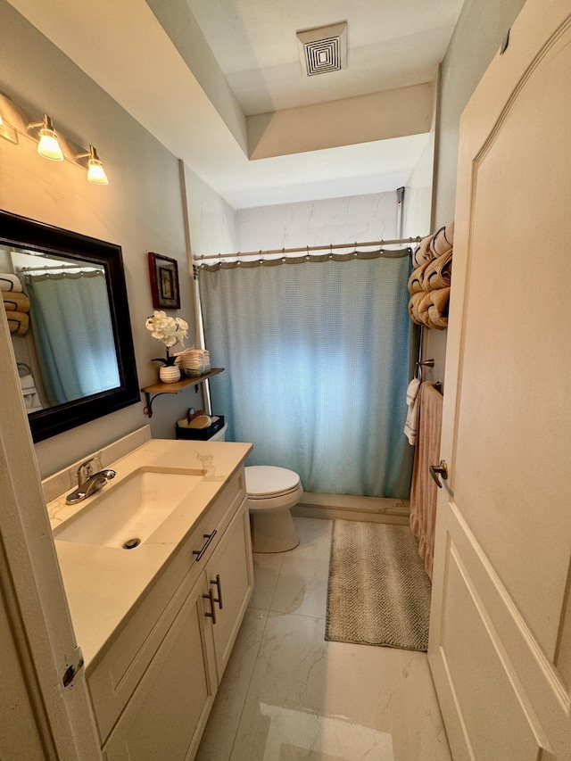 bathroom featuring marble finish floor, visible vents, vanity, and toilet