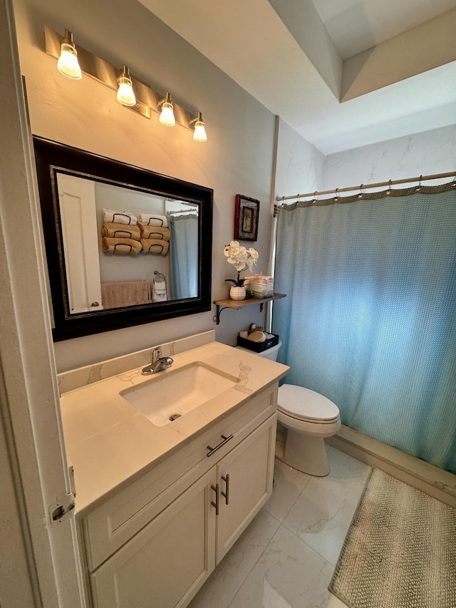 bathroom with curtained shower, marble finish floor, vanity, and toilet