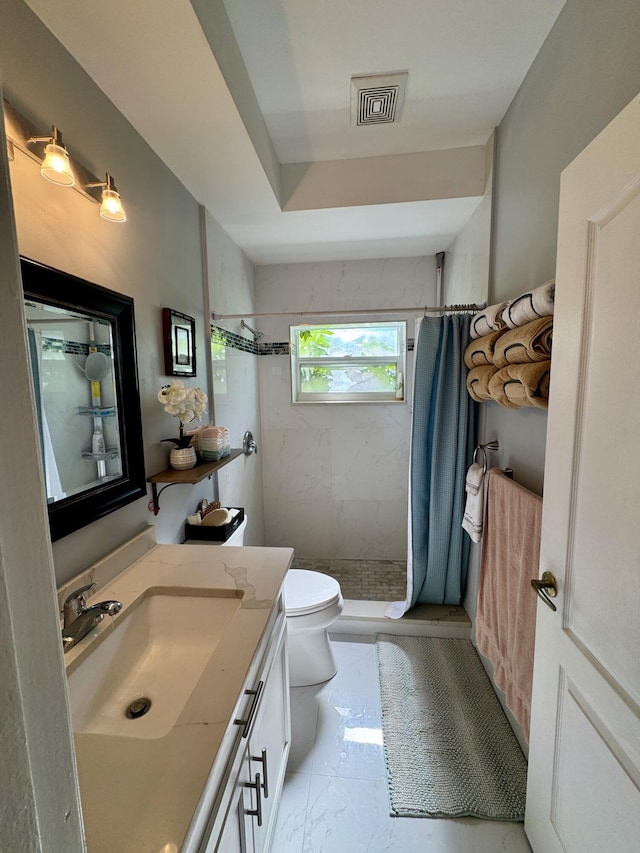 bathroom featuring visible vents, toilet, marble finish floor, vanity, and a shower stall