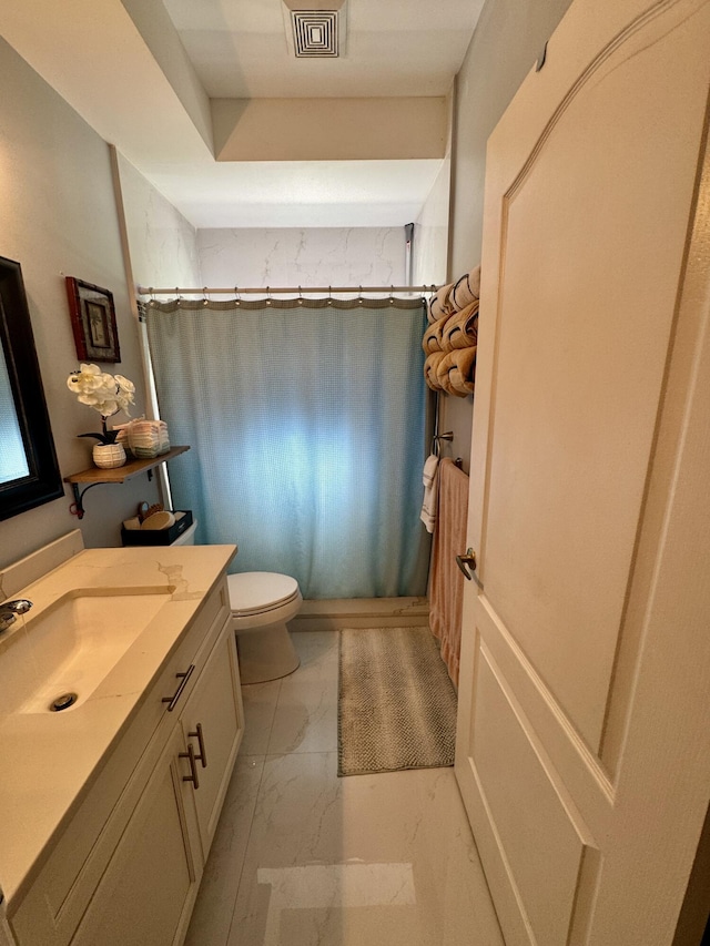 full bath featuring a shower with curtain, marble finish floor, vanity, and toilet