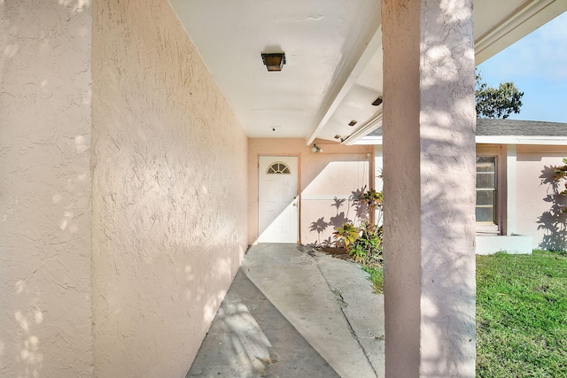 view of exterior entry featuring stucco siding