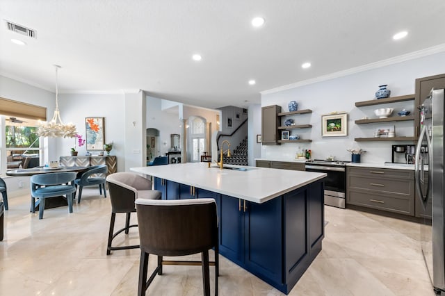 kitchen with visible vents, arched walkways, appliances with stainless steel finishes, light countertops, and open shelves