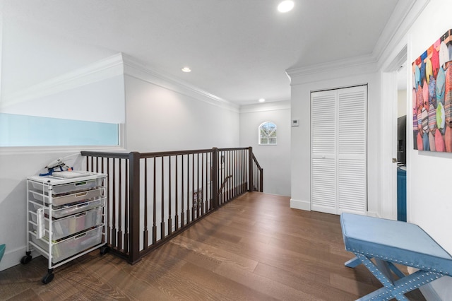 hall featuring recessed lighting, crown molding, an upstairs landing, and wood finished floors