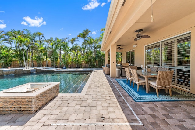 view of swimming pool featuring a fenced in pool, a fenced backyard, ceiling fan, outdoor dining area, and a patio area