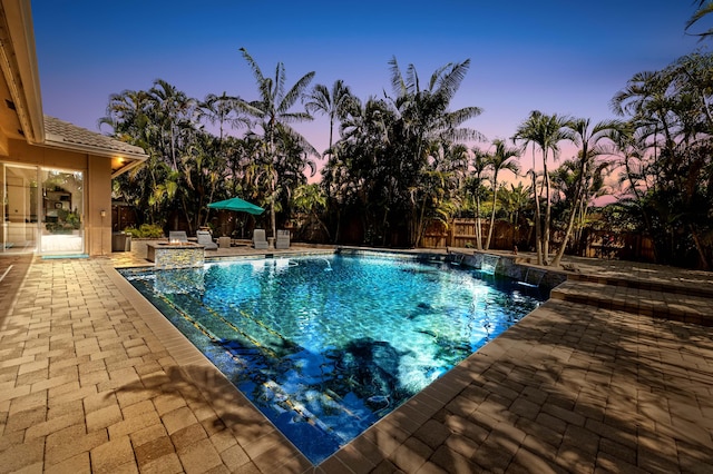 outdoor pool featuring a fenced backyard and a patio