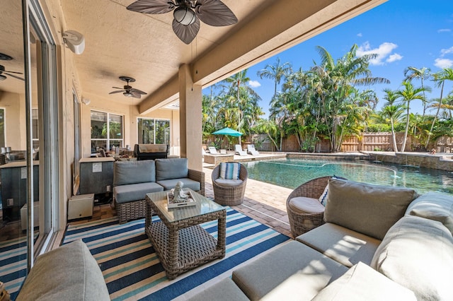 view of patio / terrace featuring an outdoor hangout area, a fenced backyard, and a fenced in pool