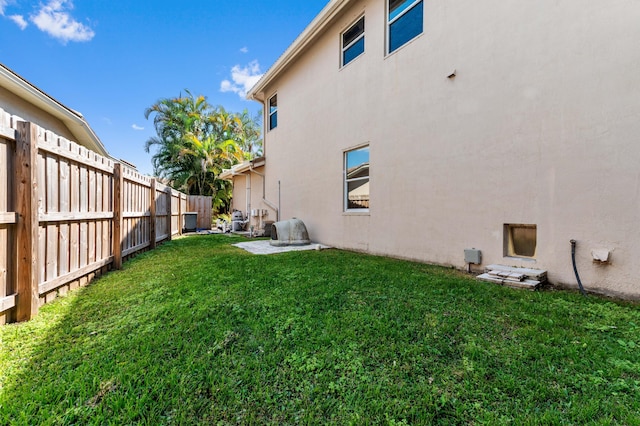 view of yard with a fenced backyard