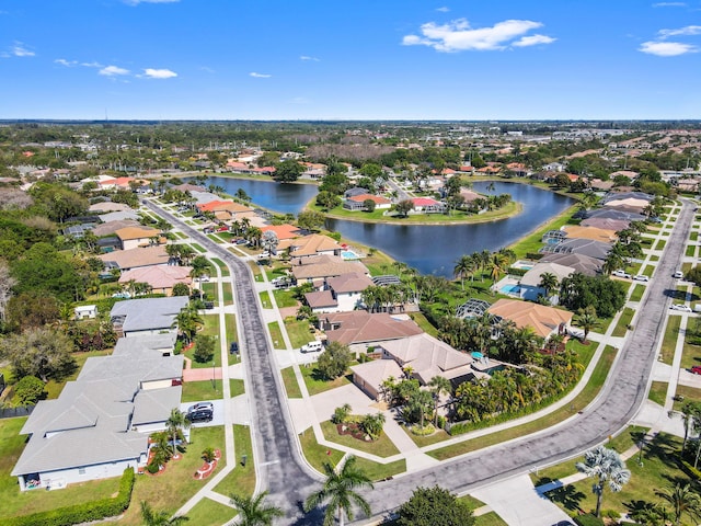 bird's eye view featuring a water view and a residential view