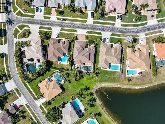 aerial view with a water view and a residential view