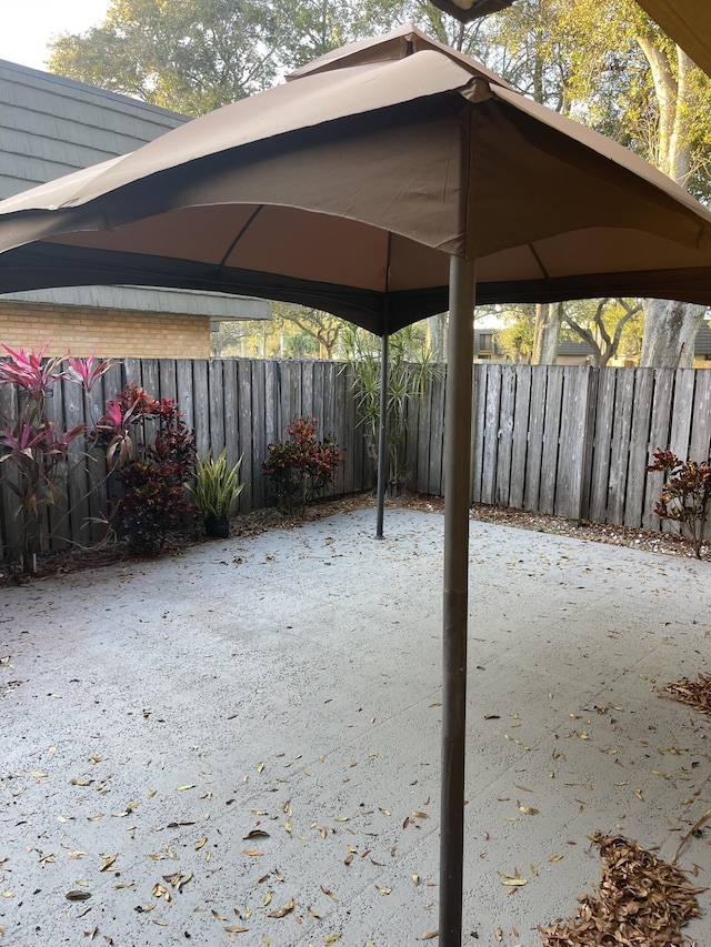 view of patio / terrace featuring fence