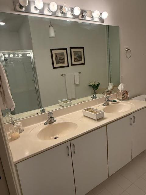 6367 Long Key Ln, Boynton Beach, FL 33472 - bathroom with double vanity, a shower stall, and tile patterned flooring