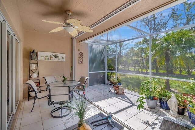 sunroom with a ceiling fan