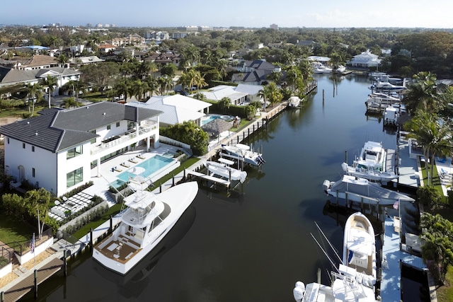 birds eye view of property with a residential view and a water view