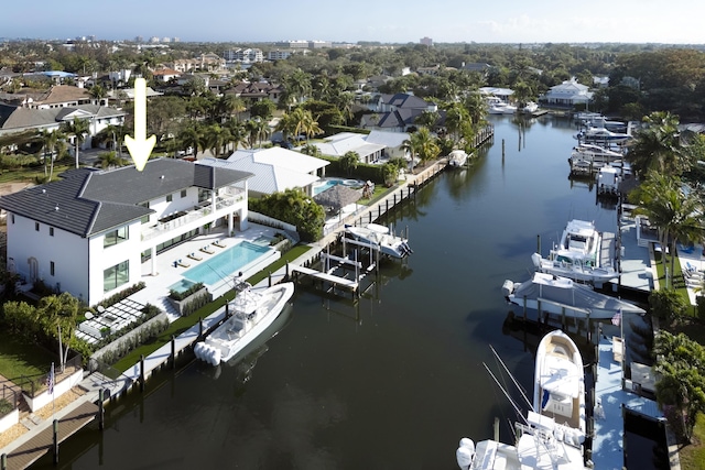 aerial view featuring a residential view and a water view