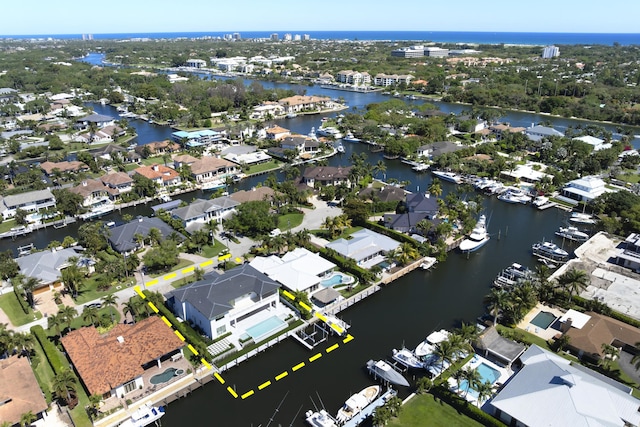 birds eye view of property featuring a water view and a residential view