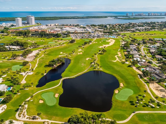 aerial view featuring a water view, a city view, and golf course view