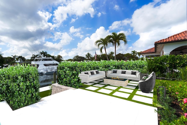 view of patio / terrace with an outdoor living space with a fire pit