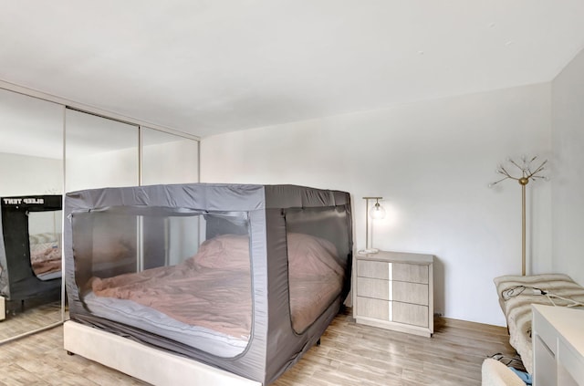 bedroom featuring wood finished floors