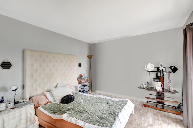 bedroom featuring wood finished floors