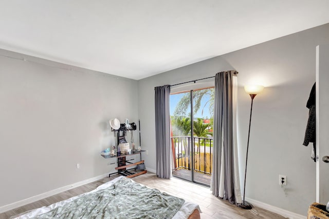 interior space featuring light wood-type flooring and baseboards