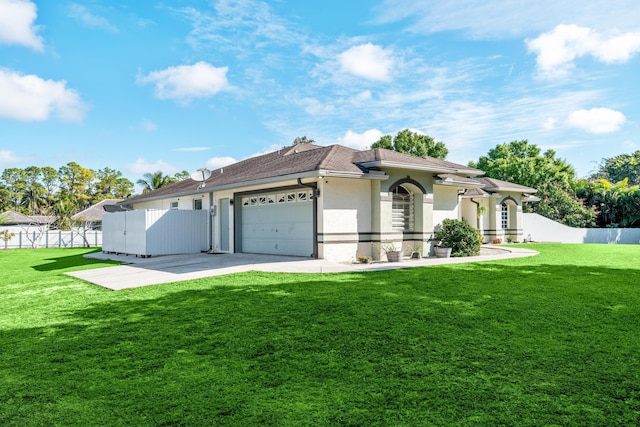 view of front of property featuring concrete driveway, an attached garage, fence, and stucco siding