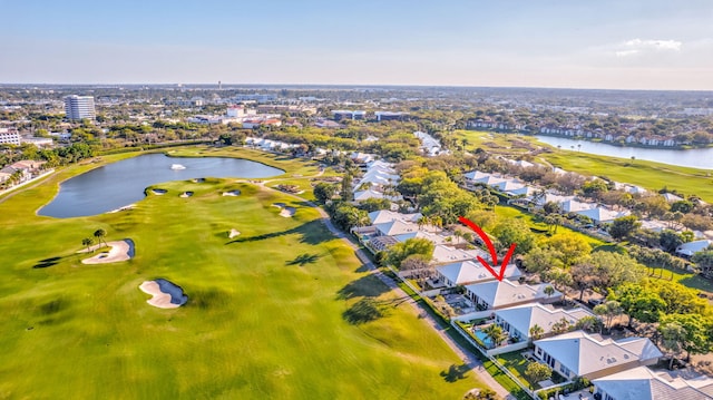 bird's eye view featuring view of golf course, a water view, and a residential view