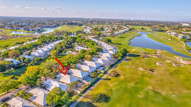 birds eye view of property with a water view, view of golf course, and a residential view