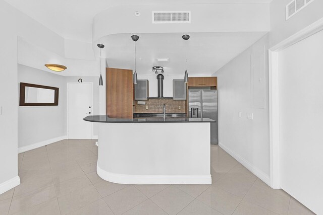 dining room with light tile patterned floors and baseboards