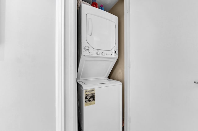 laundry area featuring laundry area and stacked washer / dryer