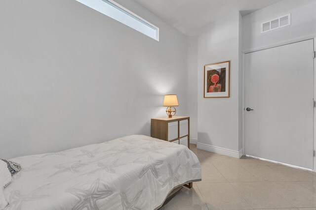 carpeted bedroom with baseboards