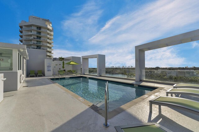 view of patio featuring a view of city and a balcony