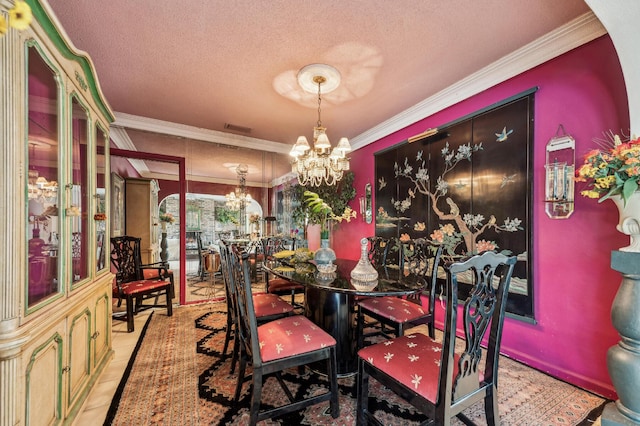 tiled dining area with visible vents, a textured ceiling, ornamental molding, and a notable chandelier