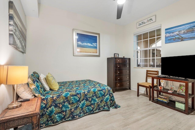 bedroom featuring wood finished floors and a ceiling fan