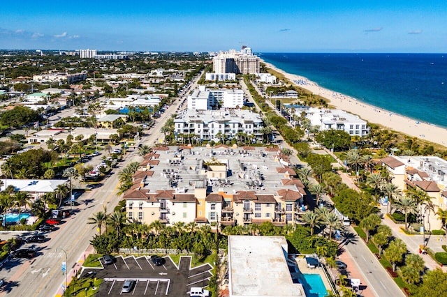 aerial view featuring a water view and a beach view