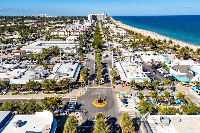 bird's eye view featuring a water view and a beach view