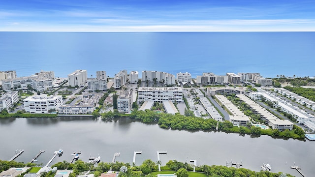 birds eye view of property featuring a view of city and a water view