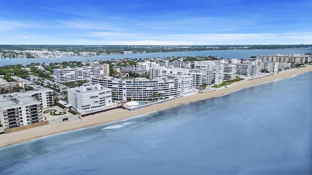 bird's eye view featuring a view of city, a beach view, and a water view