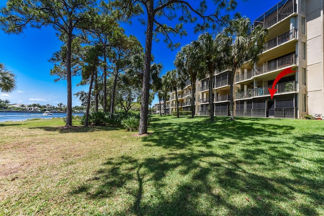 1001 Seafarer Cir Unit 102, Jupiter, FL 33477 - view of green lawn featuring a water view